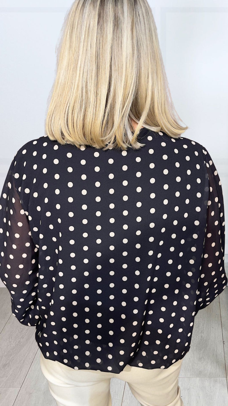 Naomi - Black Polka Print Lined bubble Hem top